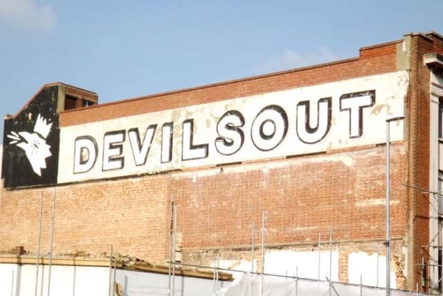Hidden signage revealed after sixty years.