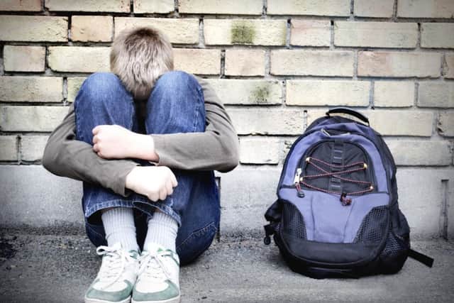 upset boy against a wall ENGEMN00120130225162843
