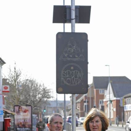 Douglas Brawley, headteacher with (right) Lib Dem Councillor Lynne Stagg outside the Copnor Primary School on the very busy Copnor Road, Portsmouth, Hampshire where automated maximum speed advisory signs have been installed Picture by:  Malcolm Wells