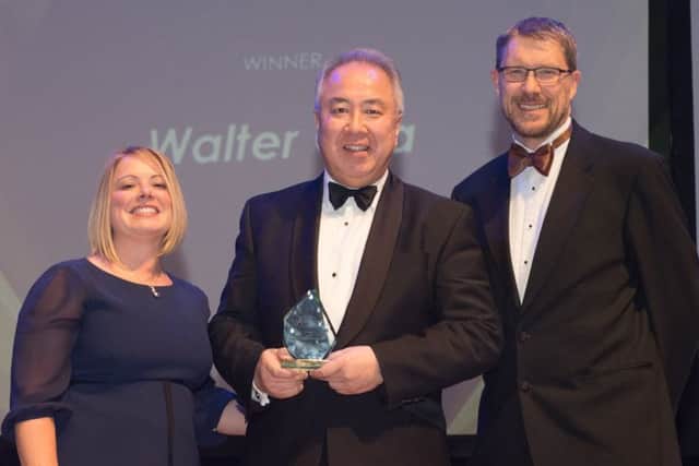 Walter Cha, Lifetime Achievement winner, with Lucy Grey from lead sponsor Trethowans and Mark Waldron, editor of The News. Picture: Keith Woodland