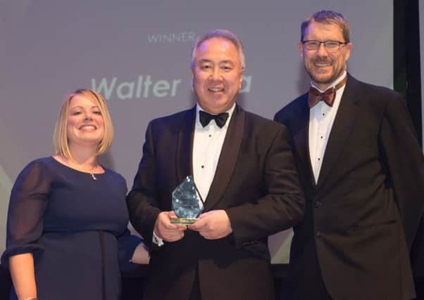 Walter Cha, Lifetime Achievement winner, with Lucy Grey from lead sponsor Trethowans and Mark Waldron, editor of The News.  Picture: Keith Woodland