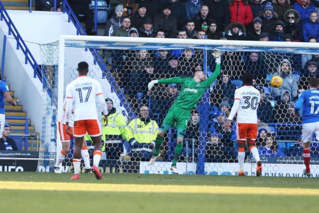 Luke McGee can't stop Clark Robertson's header giving Blackpool a 2-0 lead at Fratton Park