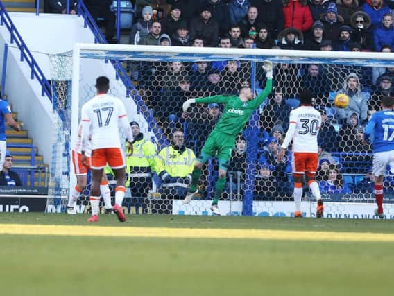 Luke McGee can't stop Clark Robertson's header giving Blackpool a 2-0 lead at Fratton Park