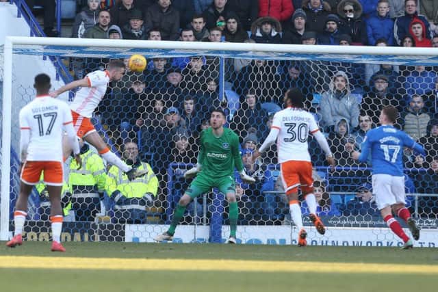 Clark Robertson scores Blackpool's second goal in their 2-0 win against Pompey Picture: Joe Pepler