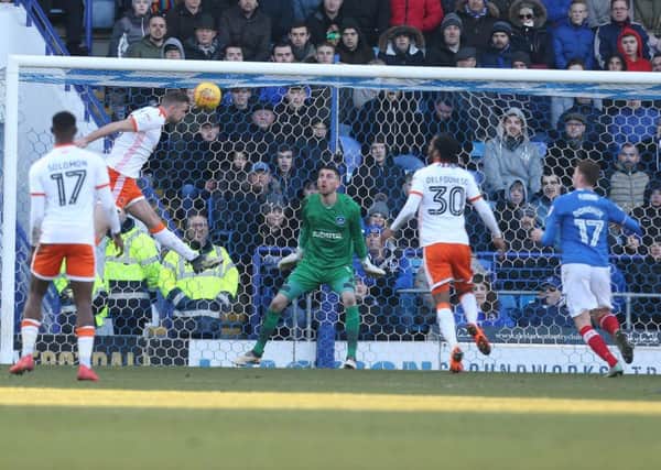 Clark Robertson scores Blackpool's second goal in their 2-0 win against Pompey Picture: Joe Pepler