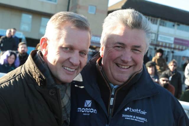 Jeremy Kyle, left, celebrates with trainer Paul Nicholls. Picture: Fontwell Park