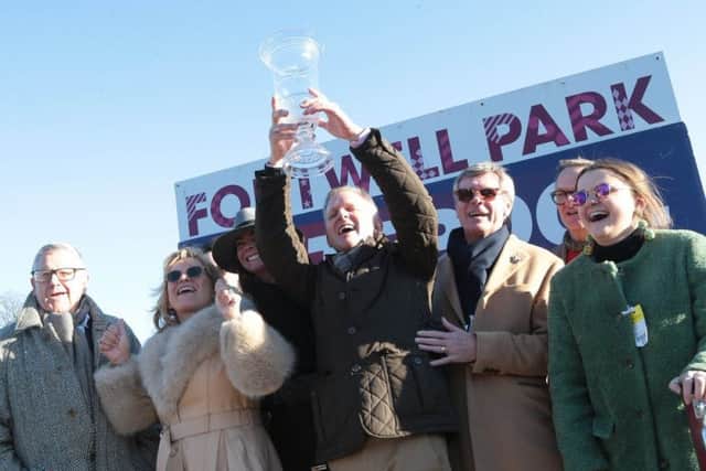 Jeremy Kyle leads the owners in celebration at the prize giving. Picture: Arena Racing Company/Fontwell Park