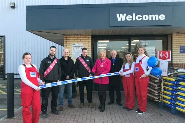 Deputy Mayor Mrs Susan Bayford and consort Cllr Brian Bayford with staff at the opening of the new store