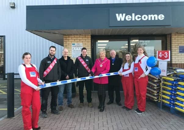 Deputy Mayor Mrs Susan Bayford and consort Cllr Brian Bayford with staff at the opening of the new store
