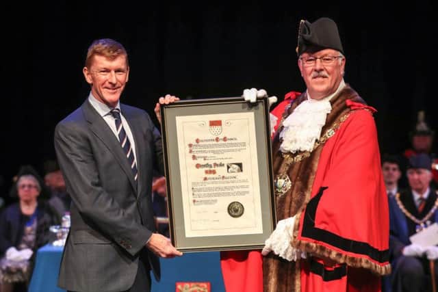 Mayor Peter Evens presents a certificate to astronaut Tim Peake after he received the freedom honour in Chichester. Picture by Andrew Matthew / PA