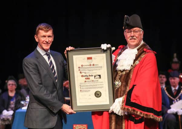 Mayor Peter Evens presents a certificate to astronaut Tim Peake after he received the freedom honour in Chichester. Picture by Andrew Matthew / PA