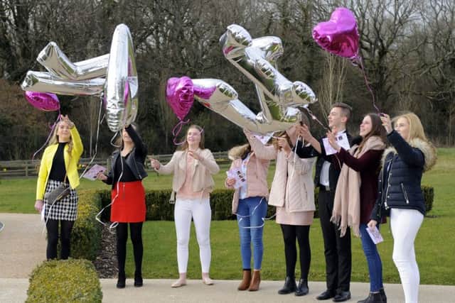 Katie's friends released balloons after the service