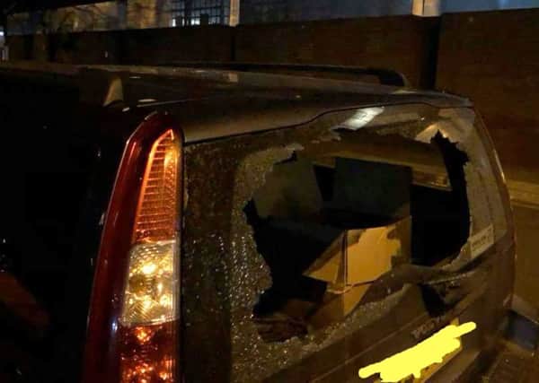 Thugs smashed the window of the charity's car, stealing clothes from the homeless and a laptop used by Helping Hands Portsmouth