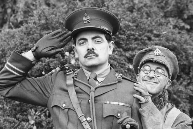 Rowan Atkinson as Captain Edmund Blackadder (left) with Tony Robinson as Private Baldrick in Blackadder Goes Forth.