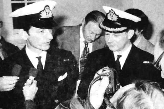 Surrounded by journalists, Lt-Commander Peter Paget, RNR, left, is pictured with Commander George Beattle, QC, RNR, his defence counsel after the verdict