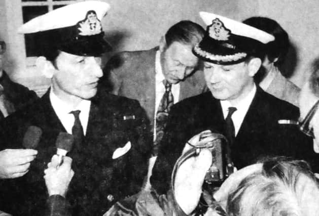 Surrounded by journalists, Lt-Commander Peter Paget, RNR, left, is pictured with Commander George Beattle, QC, RNR, his defence counsel after the verdict