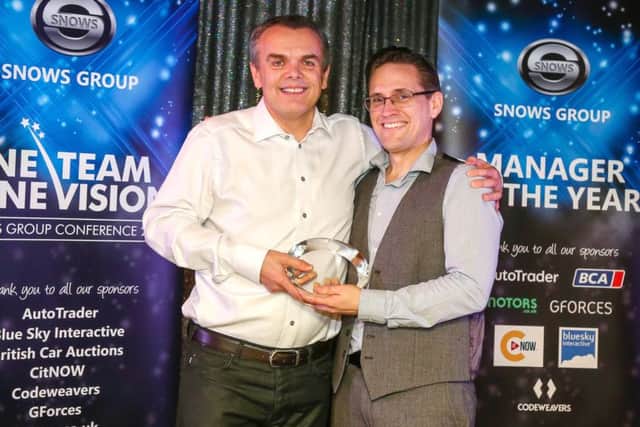 IT manager Stuart Truman, right, receives the inaugural Driving Spirit Manager of the Year award from Stephen Snow, group chairman