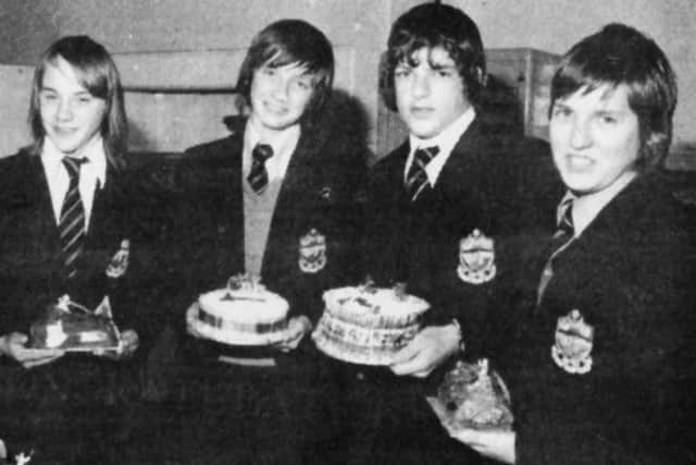 When I was at school in the 1960s boys did metalwork and woodwork and girls learned to cook and type. By 1975 that had all changed, I am glad to say, and here we see lads from the City of Portsmouth Boys School  at Hilsea showing off their Christmas cakes. They had entered a competition to find the best. Are you one the boys here? Perhaps you won the competition?