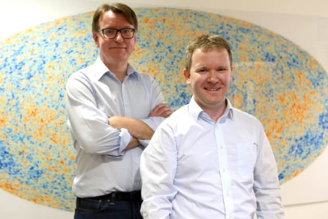 Professor Bob Nichol and Dr David Bacon in front of a Cosmic Microwave background