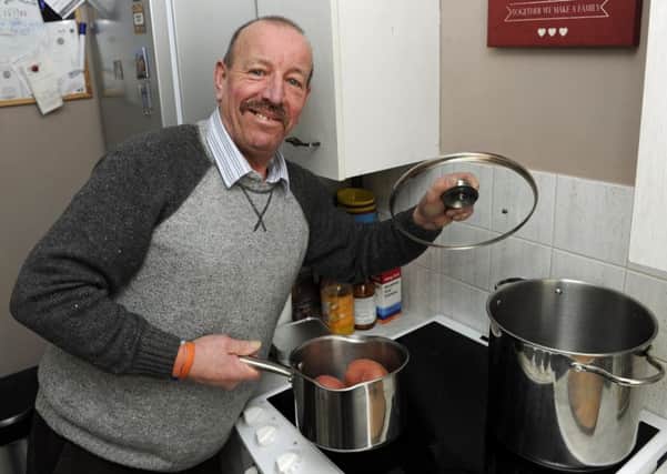 Bill Shannon from Fratton gets to prepare another batch of meals which after cooking he takes directly to local homeless people.
Picture: Ian Hargreaves  (180209-1)