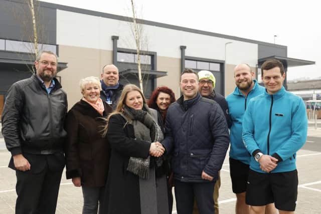 PCC leader Cllr Donna Jones is joined by cabinet members Cllr Luke Stubbs and Cllr Linda Symes and Portsmouth Retail Park's first tenants, as she is officially handed the site by Martin Burge, project director for site builder Simons Group