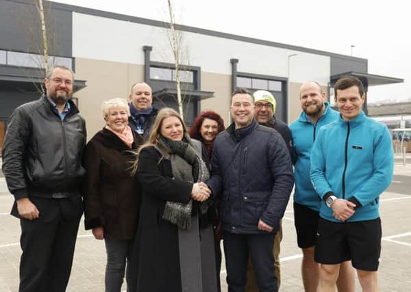PCC leader Cllr Donna Jones is joined by cabinet members Cllr Luke Stubbs and Cllr Linda Symes and Portsmouth Retail Park's first tenants, as she is officially handed the site by Martin Burge, project director for site builder Simons Group