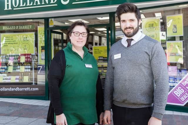 A new Holland and Barrett store has opened on Cosham high street. Pictured is store manager Jamie Clark and his colleague Nicki. Picture: Holland and Barrett PPP-180103-145144001