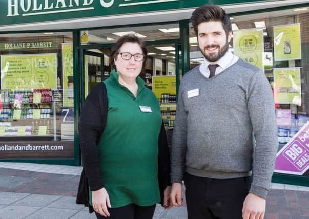 A new Holland and Barrett store has opened on Cosham high street. Pictured is store manager Jamie Clark and his colleague Nicki. Picture: Holland and Barrett PPP-180103-145144001