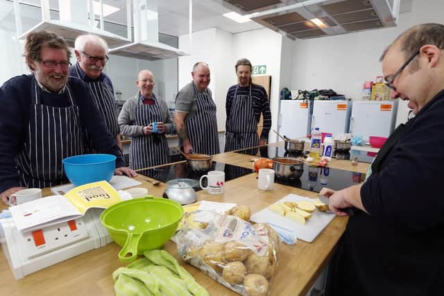 A demonstration from one of the leaders, Trevor, right. Mens' Kitchen at Pompey in The Community, Anson Road, Fratton. Picture: Chris Moorhouse
