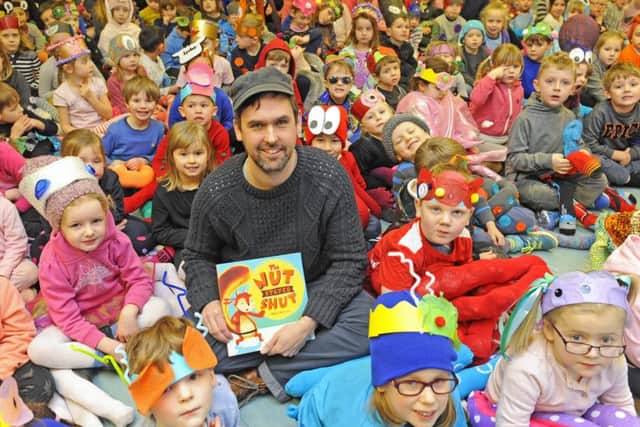 Author Mike Henson with pupils at Mill Rythe Infant School