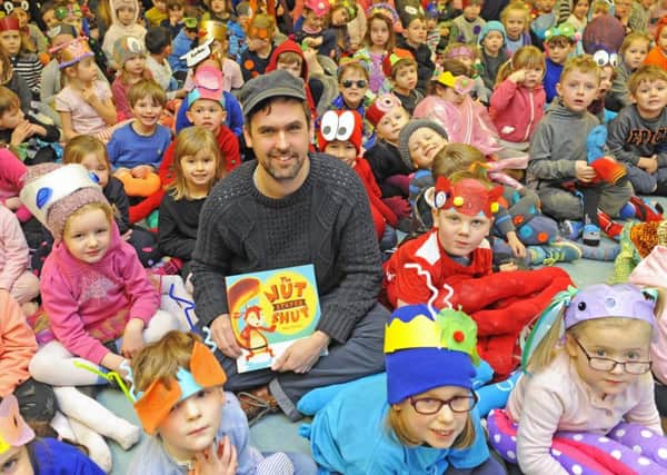 Author Mike Henson with pupils at Mill Rythe Infant School