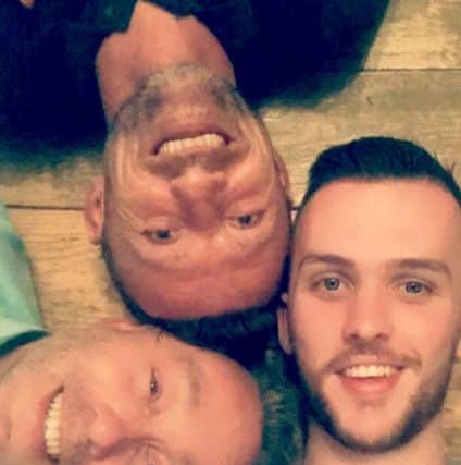 HAPPY FAMILY Rory, far right, with Deamonn and Barry