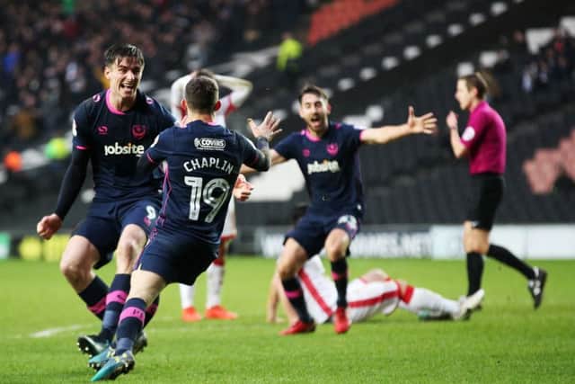 Pompey celebrate Conor Chaplin's late winner. Picture: Joe Pepler