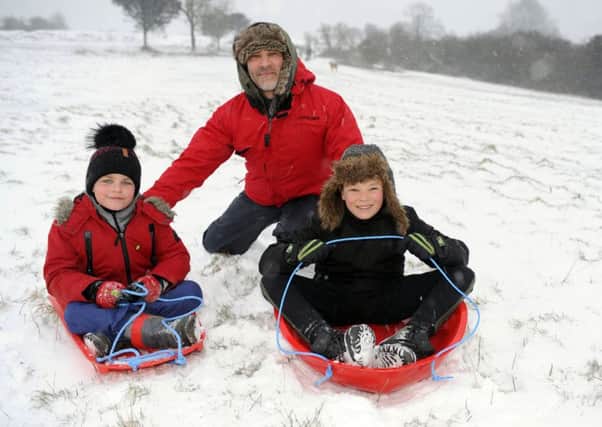 Senna, seven, left, dad Zak and Luca Reynolds, 11, on the slopes of Butser Hill 

Picture: Malcolm Wells (180301-8697)