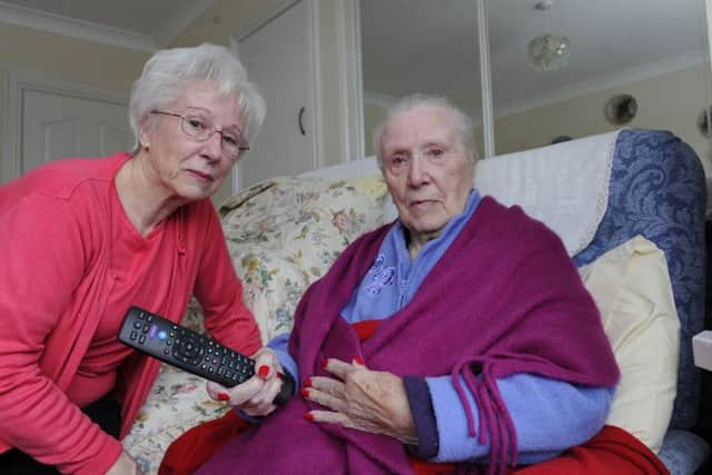Gillian Hill at home in Portchester with her elderly mum Evelyn Fullbrook who is very unhappy with BT over problems to fit a fibre line to enable her to watch her favourite TV programmes.Picture Ian Hargreaves  (180207-1)