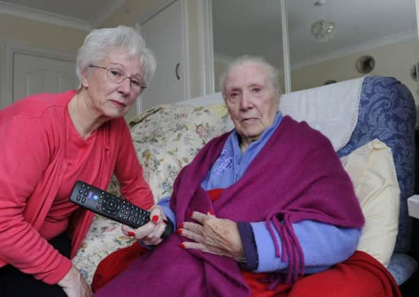 Gillian Hill at home in Portchester with her elderly mum Evelyn Fullbrook who is very unhappy with BT over problems to fit a fibre line to enable her to watch her favourite TV programmes.
Picture Ian Hargreaves  (180207-1)