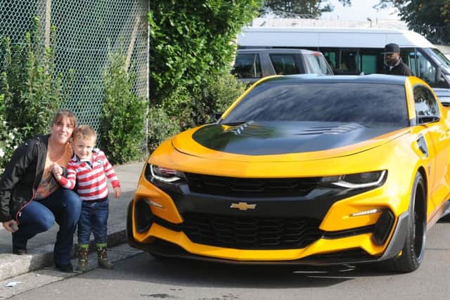 Rachel Simpson (34) with her son Aidan Simpson (3) from Fareham, posed next to Bumblebee.