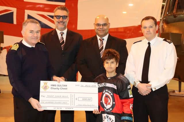 Captain Peter Towell with members of the Solent Junior Devils Ice Hockey Club
Picture: PO Phot Nicola Harper/RN