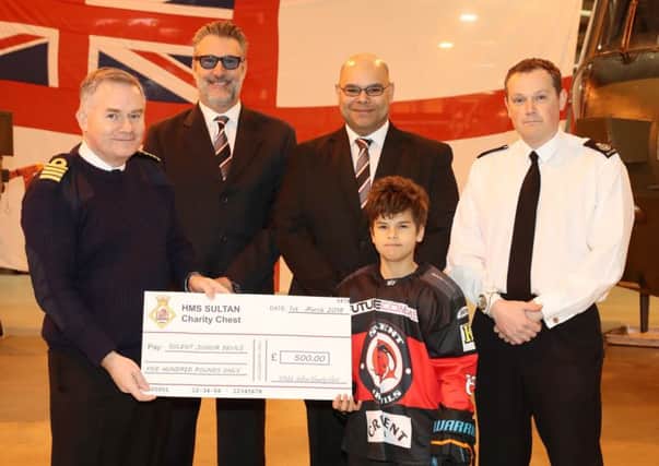 Captain Peter Towell with members of the Solent Junior Devils Ice Hockey Club
Picture: PO Phot Nicola Harper/RN