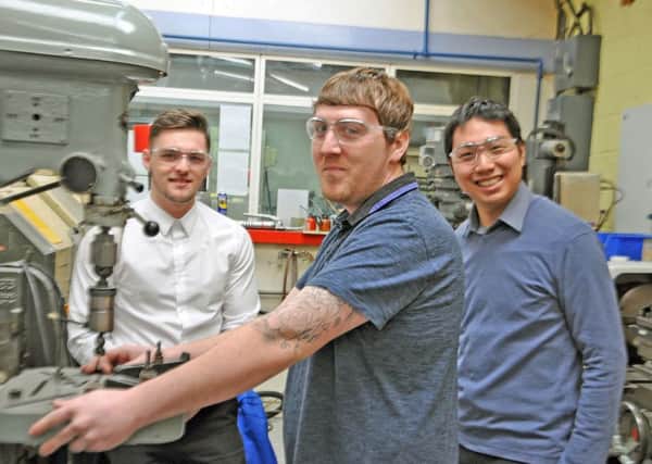 Apprentices Todd Green, Shane Hutton and graduate engineer Jack Lee at Barnbrook Systems