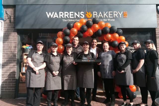 Ali Rupani, middle, with the staff at the new Warrens Bakery in Gosport High Street      Picture: David George