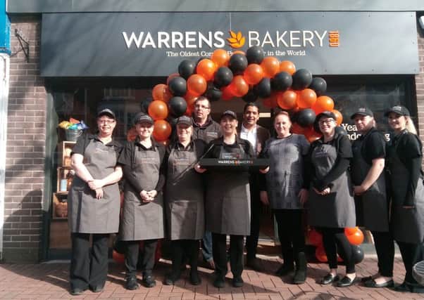 Ali Rupani, middle, with the staff at the new Warrens Bakery in Gosport High Street      Picture: David George