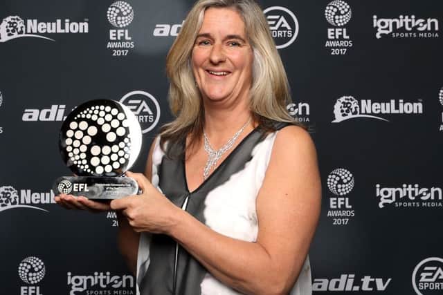 Pompey in the Community's Clare Martin collecting the Checkatrade Community Club of the Year award in 2017