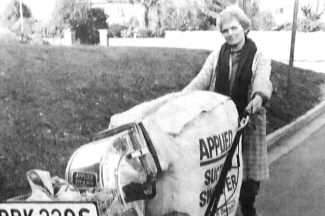 Mary Gander with the new powered sweeper
