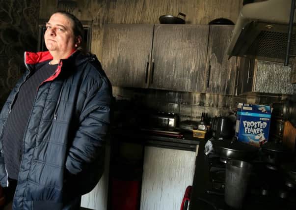 Paul Fewings in the kitchen after the fire at his flat in New Road, Buckland     Picture: Chris Moorhouse