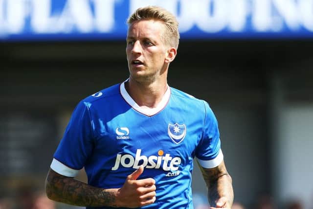 Carl Baker played through the pain barrier to help Pompey win the League Two title last season