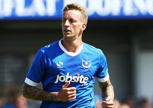 Carl Baker played through the pain barrier to help Pompey win the League Two title last season