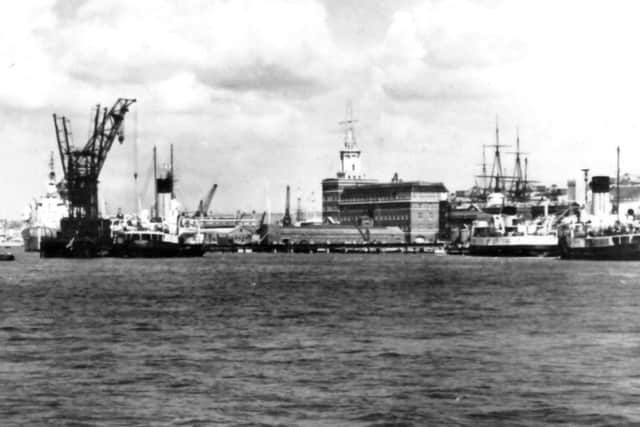 A busy Portsmouth Harbour scene  from the 1950s. The railway viaduct running from South Railway Jetty dates the photograph. Picture: Mike Nolan Collection