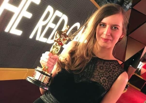Rebecca Harris clutching the Oscar for The Silent Child