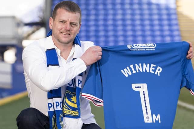 Jason Jagodzinski celebrates his £1m Lottery win at Fratton Park